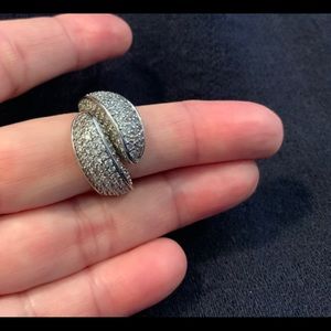 Over lapping sterling silver ring with zircons. Beautiful modern design.